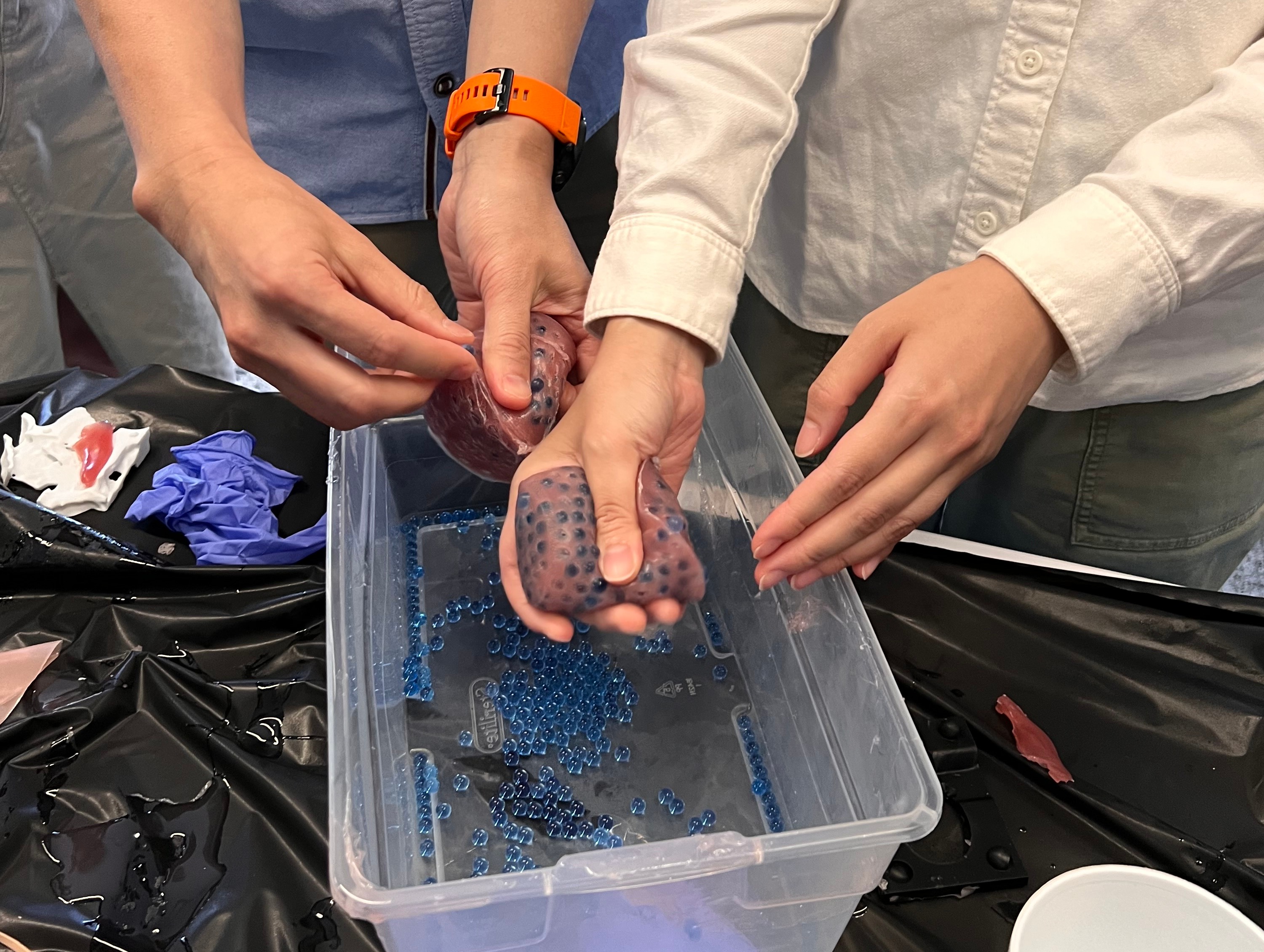 Two individuals holding medically 3D-printed content.